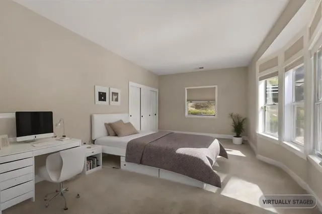a dining room with furniture a chandelier and wooden floor