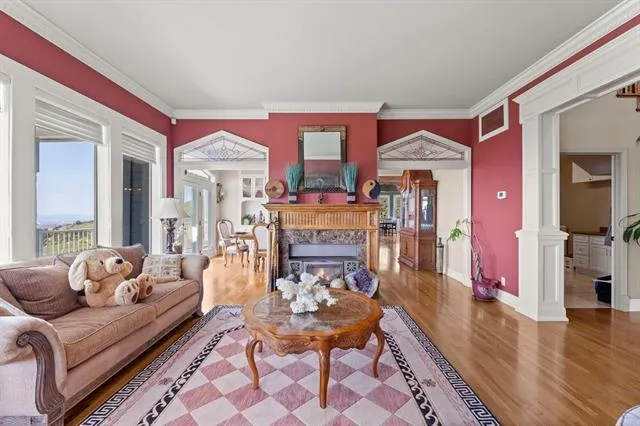 a view of a dining room with furniture and chandelier