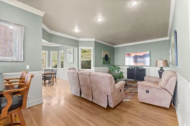 a large kitchen with stainless steel appliances granite countertop a stove and a sink