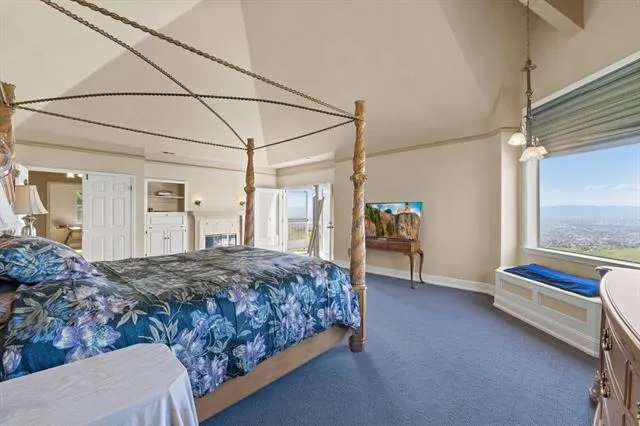 a bedroom with furniture and a window