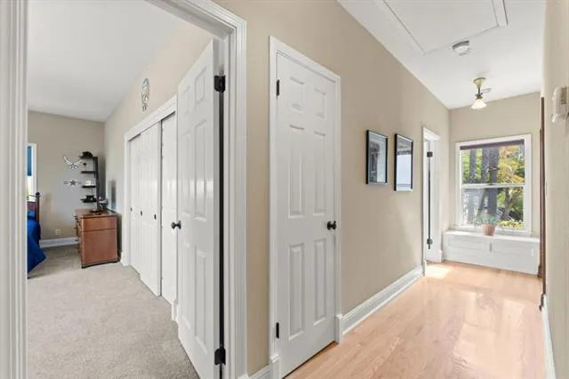 a bathroom with a granite countertop sink mirror vanity and toilet