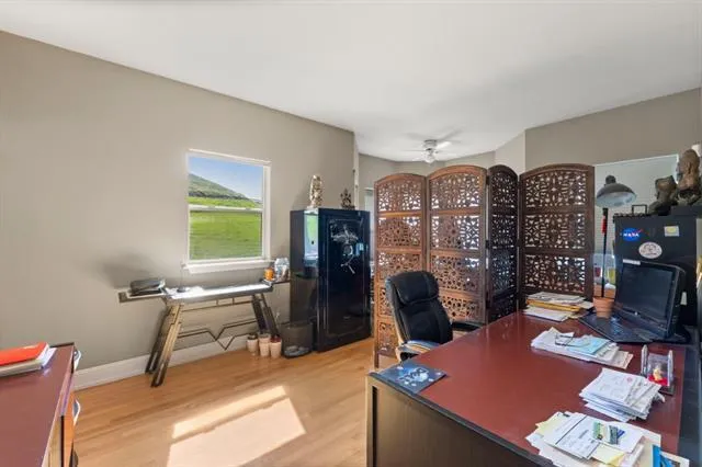 a bathroom with a sink a toilet and a window