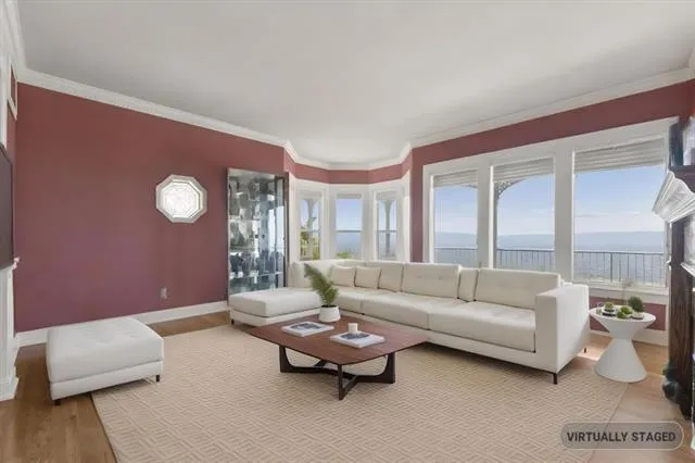 a spacious bedroom with a bed and a couch