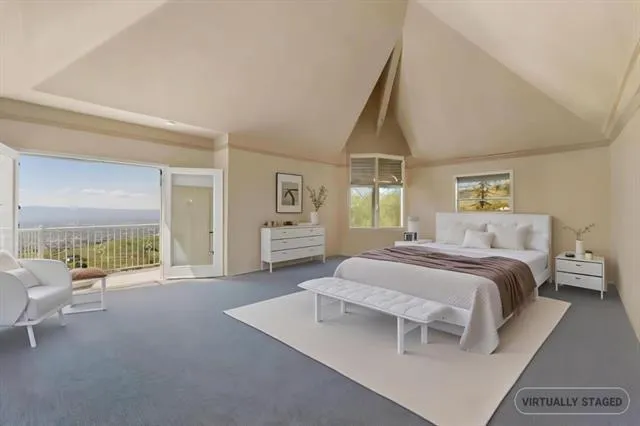 a bedroom with a bed and a tv