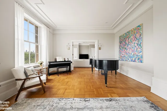 a living room with furniture and a rug