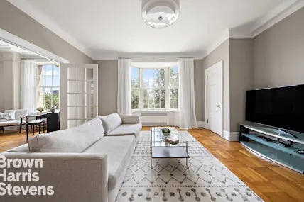 a living room with furniture and a rug
