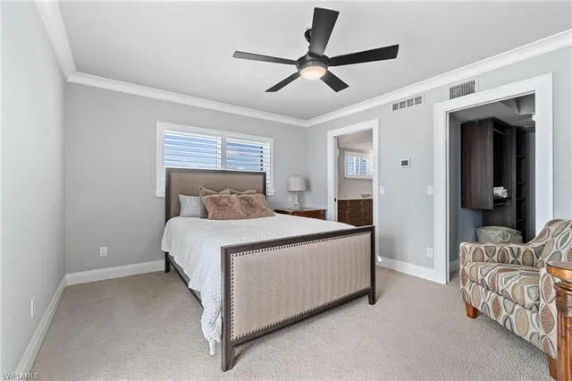 a bedroom with a bed and a bathroom