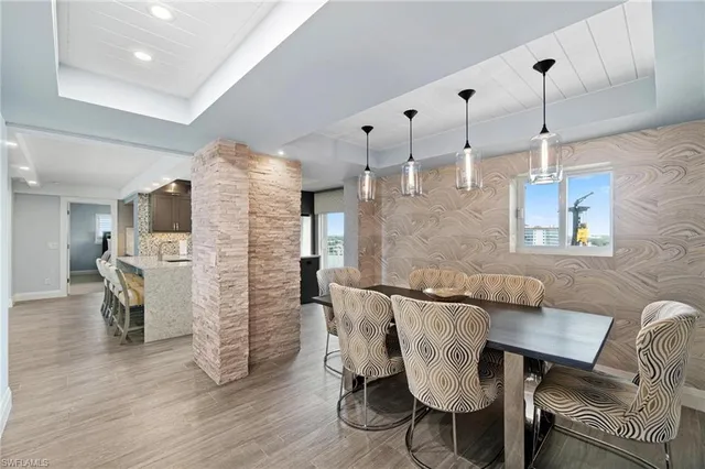a living room with furniture and kitchen view