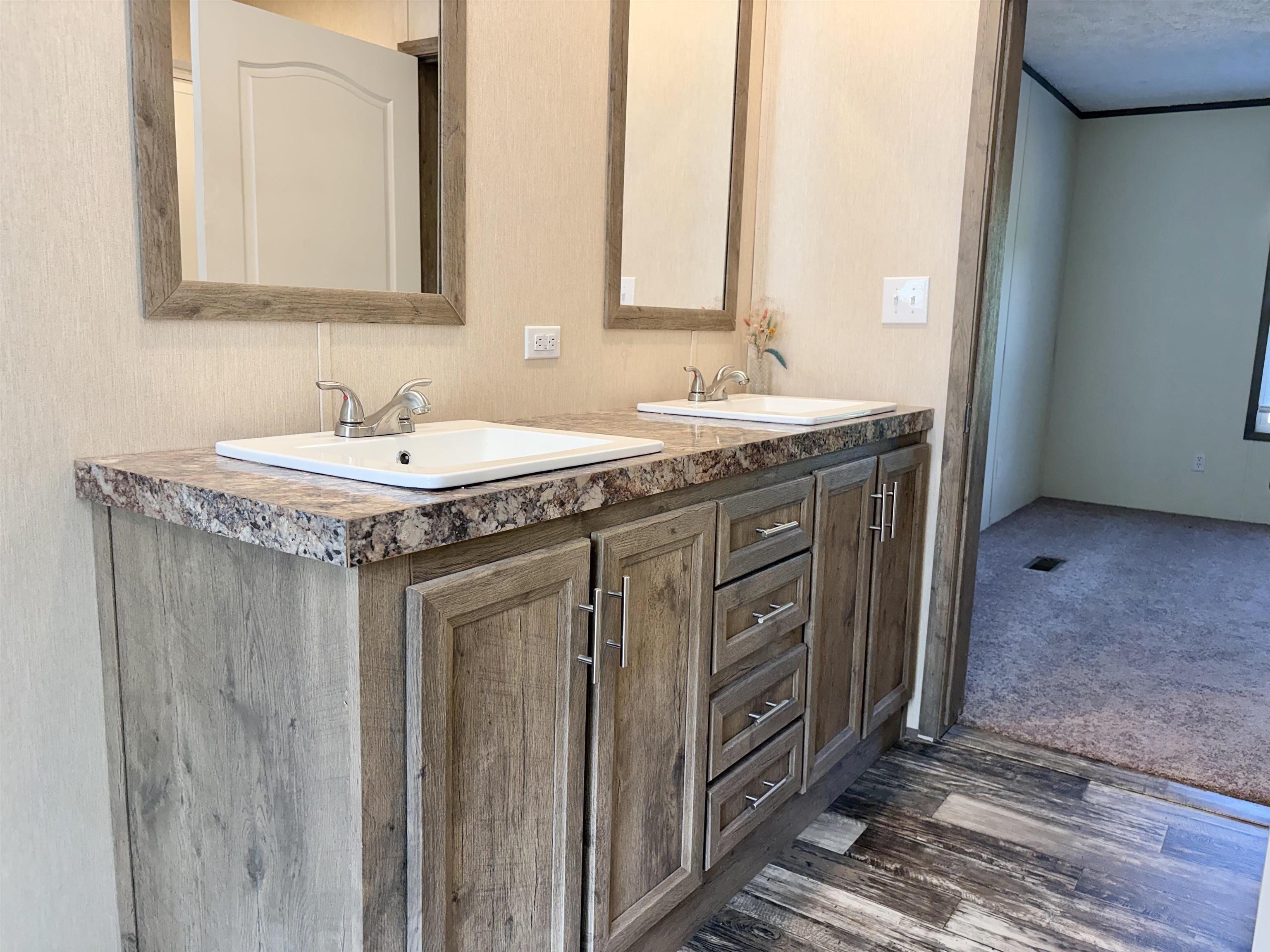 2030 Nubbin Ridge Road Middleton, TN 38052 - Photo 17 of 28 a bathroom with a granite countertop sink and a mirror