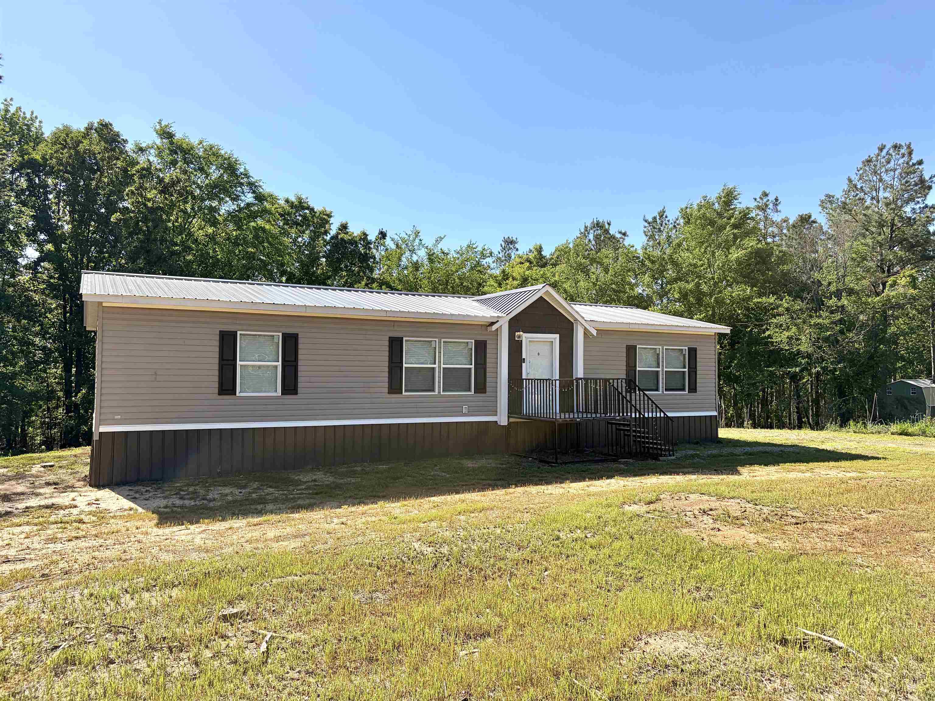 2030 Nubbin Ridge Road Middleton, TN 38052 - Photo 2 of 28 a front view of a house with a yard
