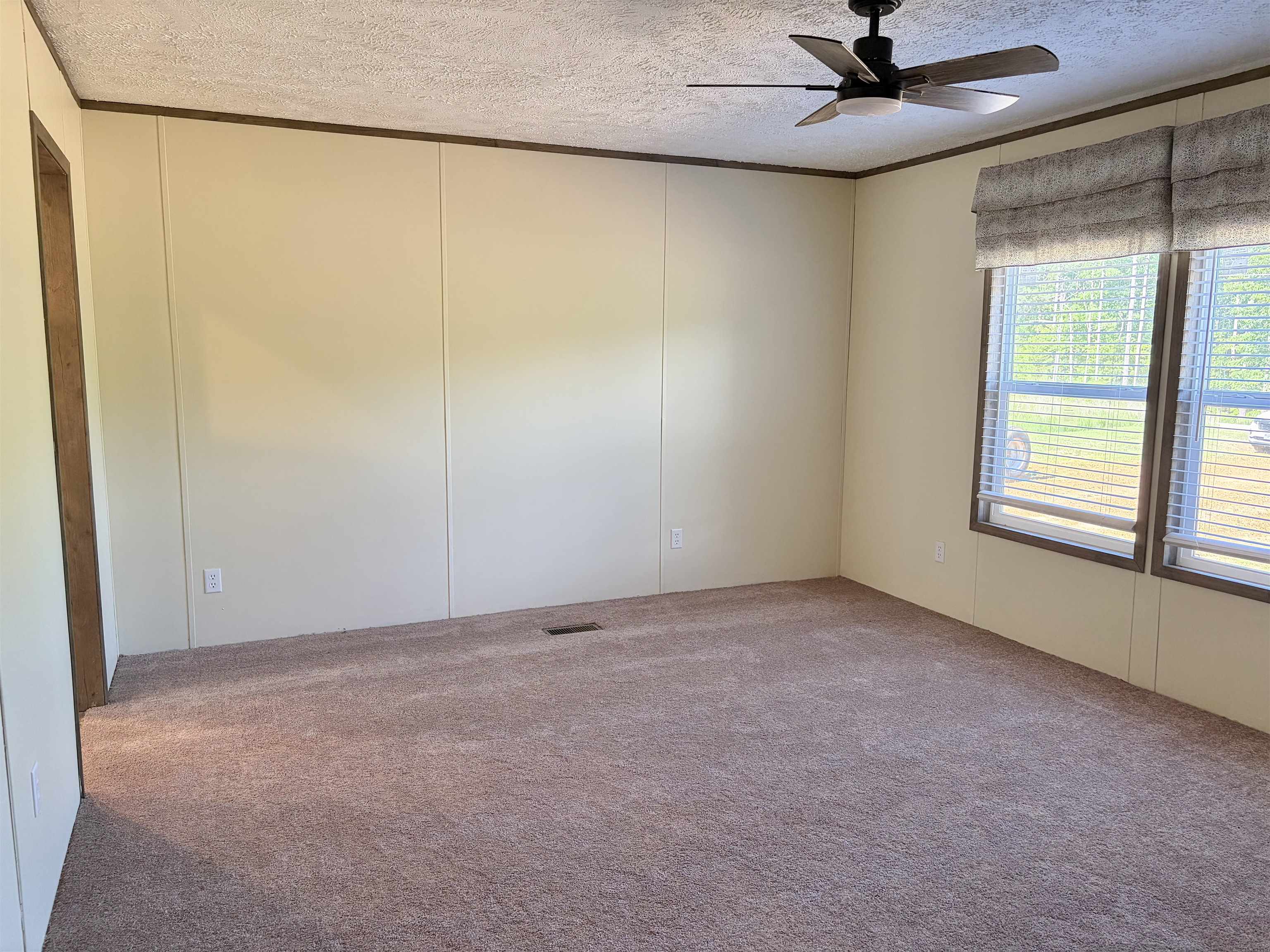 2030 Nubbin Ridge Road Middleton, TN 38052 - Photo 23 of 28 an empty room with a window and a fan