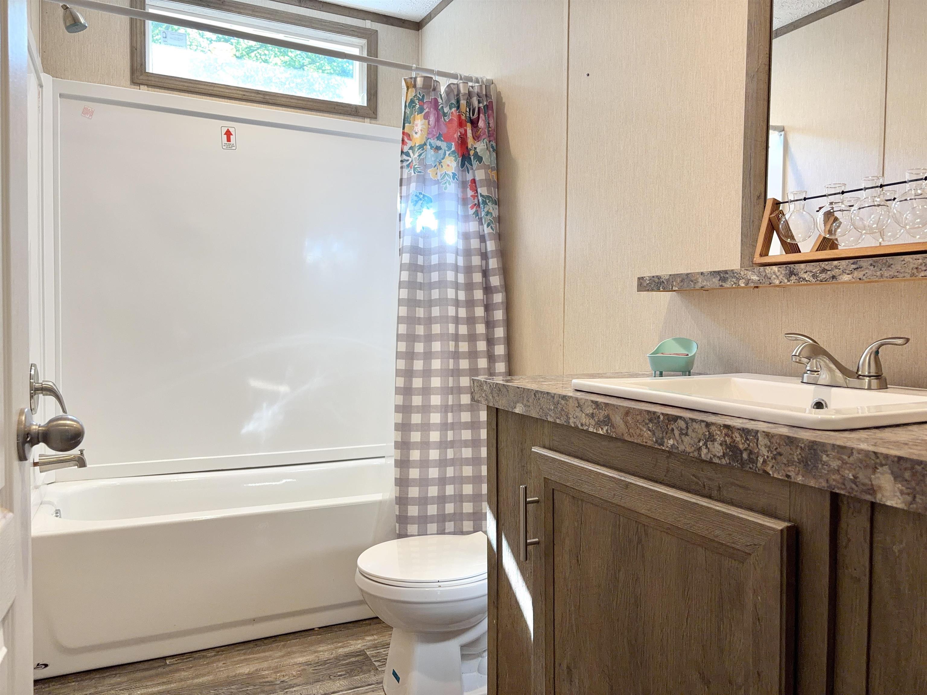 2030 Nubbin Ridge Road Middleton, TN 38052 - Photo 28 of 28 a bathroom with a sink a toilet and shower