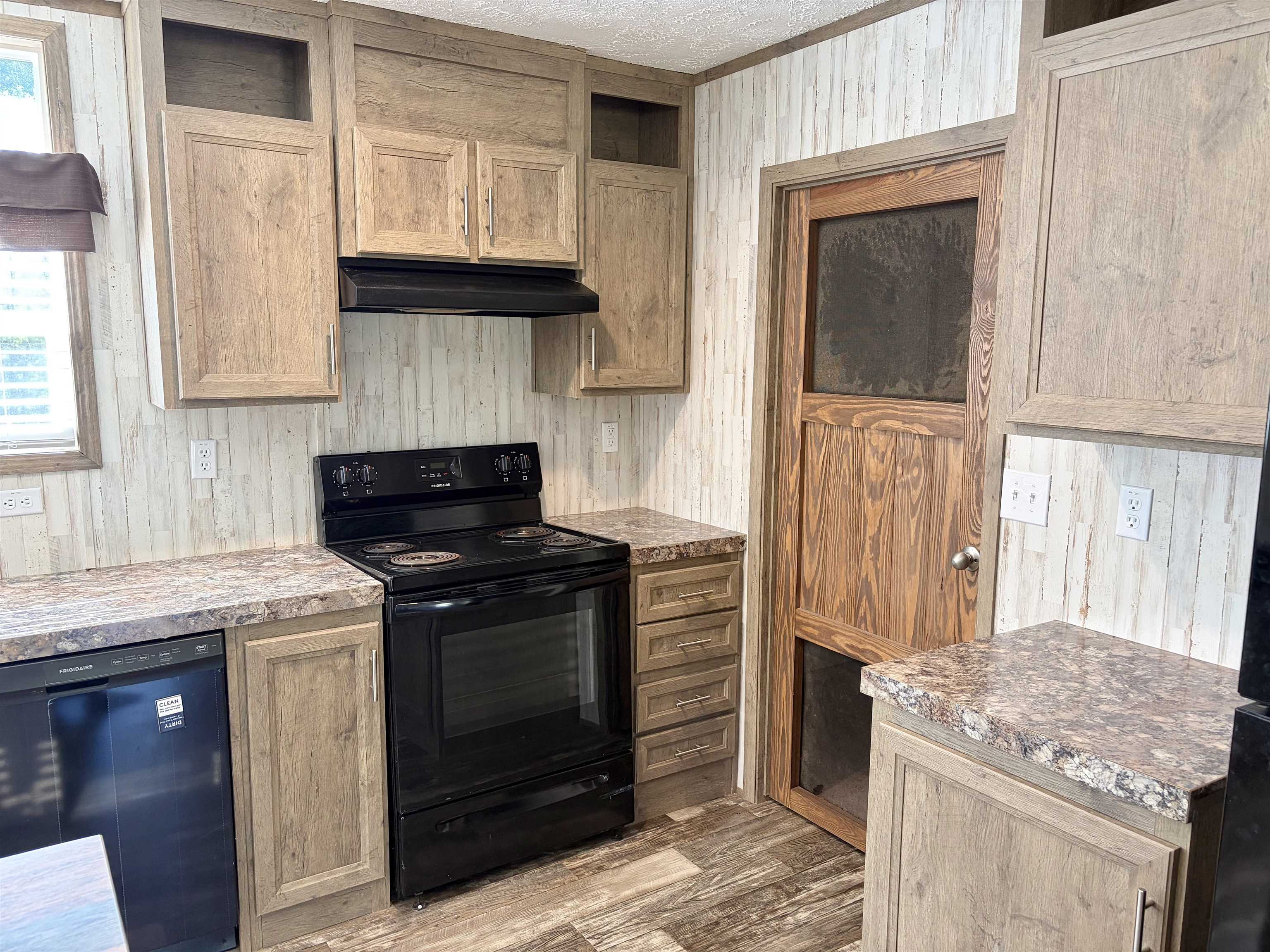 2030 Nubbin Ridge Road Middleton, TN 38052 - Photo 7 of 28 a kitchen with granite countertop a stove and a sink