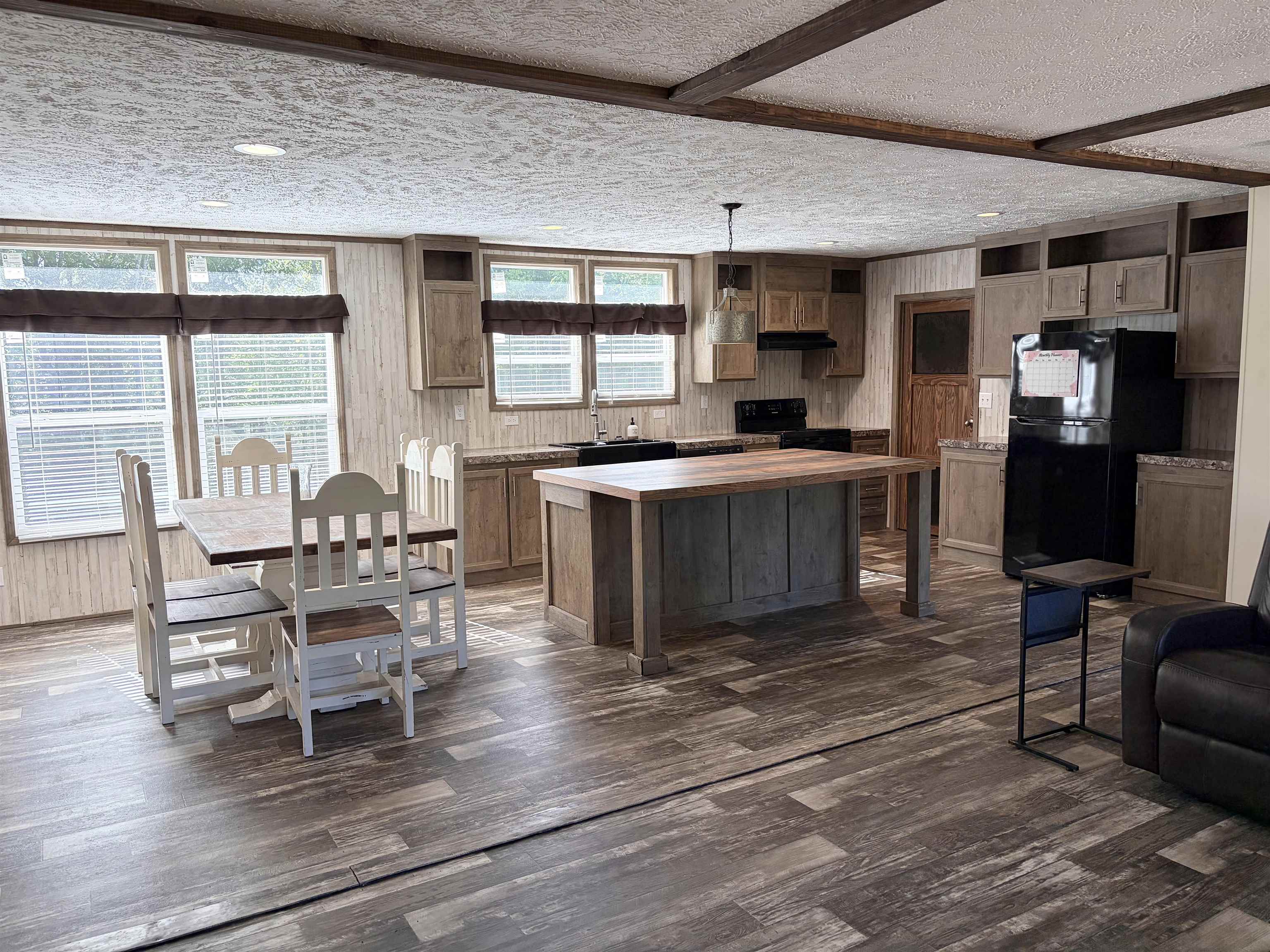 2030 Nubbin Ridge Road Middleton, TN 38052 - Photo 8 of 28 a living room with furniture a large window and wooden floor