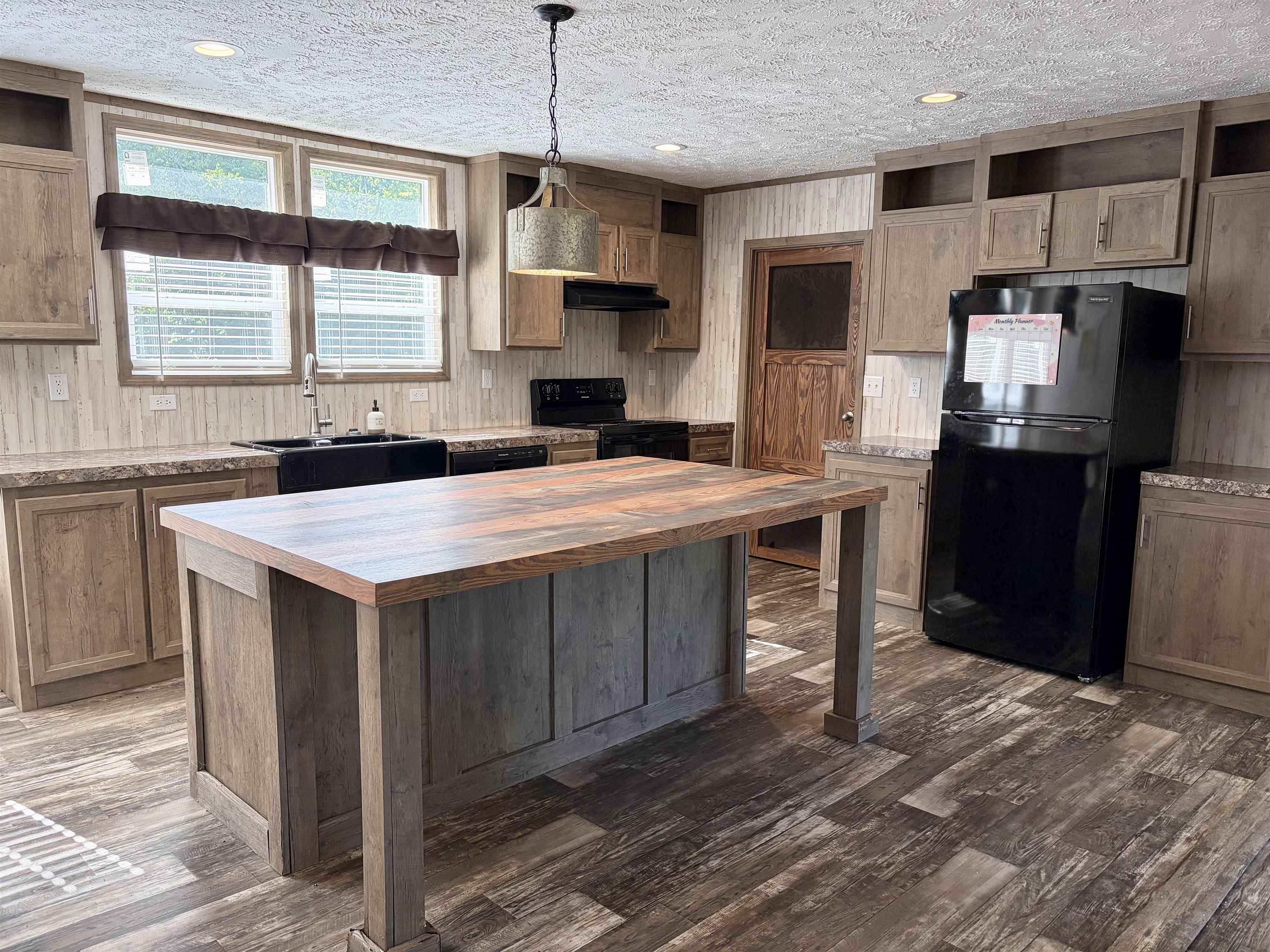 2030 Nubbin Ridge Road Middleton, TN 38052 - Photo 9 of 28 a kitchen with kitchen island granite countertop a sink appliances and cabinets