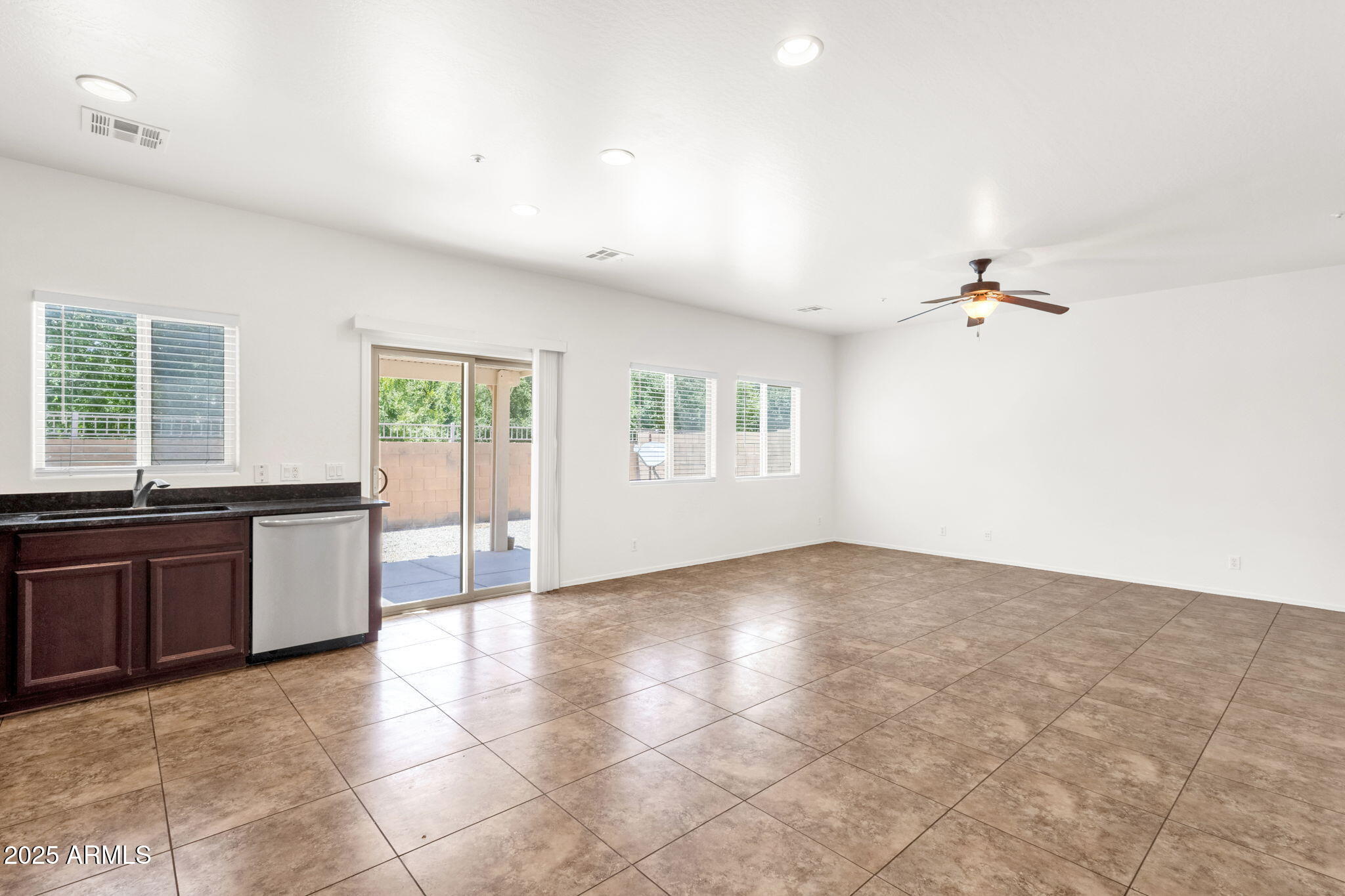 13414 North 87th Lane Peoria, AZ 85381 - Photo 12 of 45 a view of a kitchen with a sink and cabinets