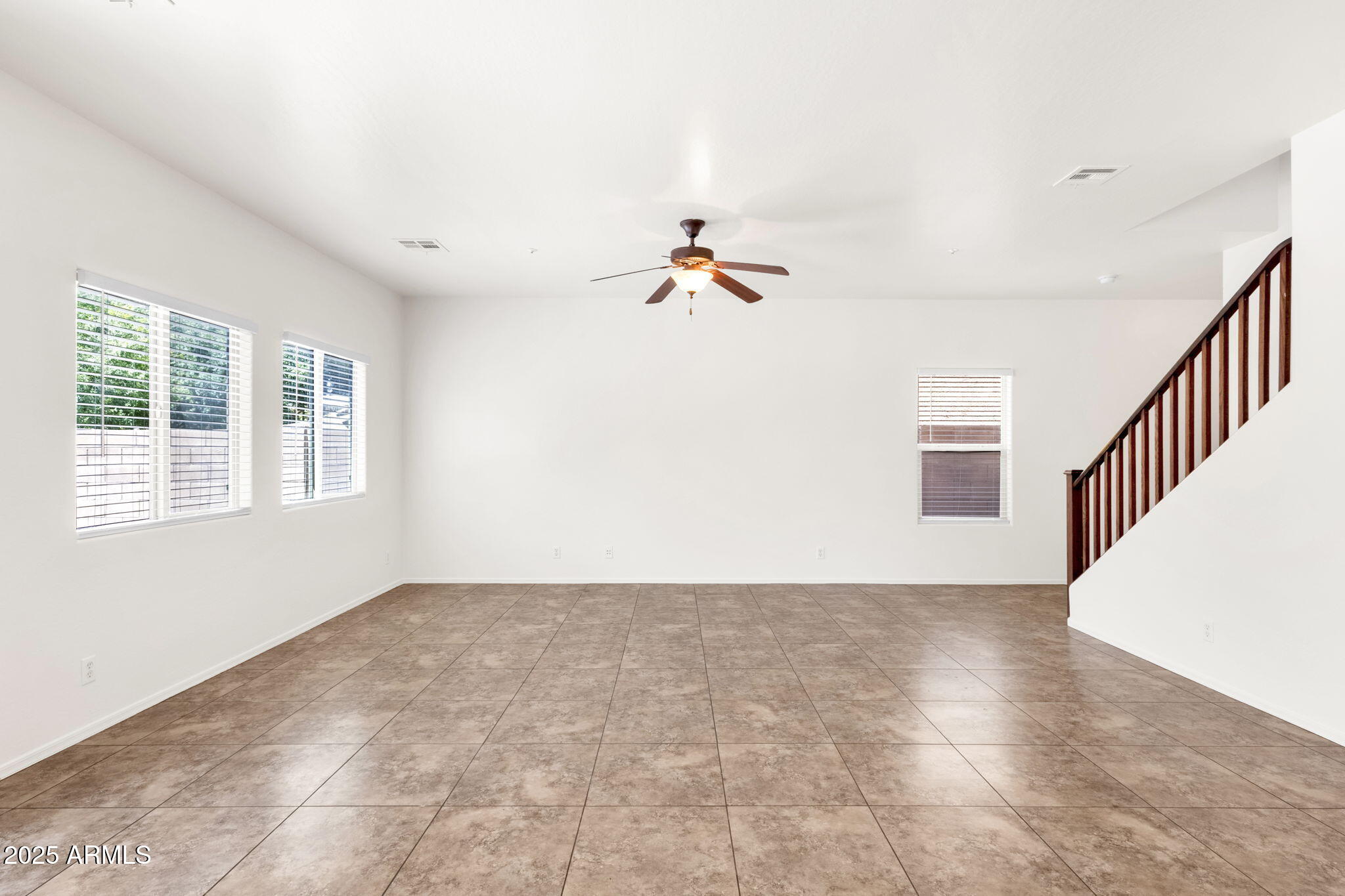 13414 North 87th Lane Peoria, AZ 85381 - Photo 14 of 45 a view of an empty room with a window