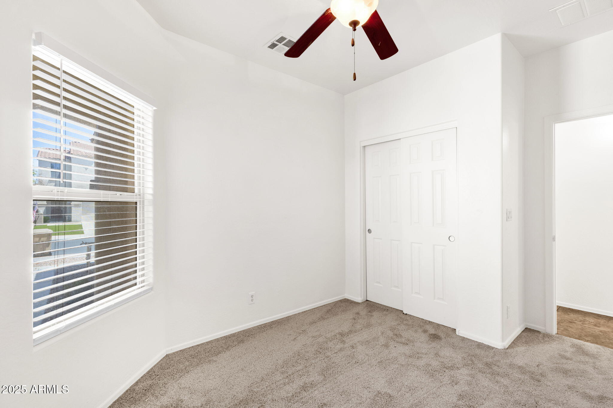 13414 North 87th Lane Peoria, AZ 85381 - Photo 16 of 45 a view of a livingroom with a window