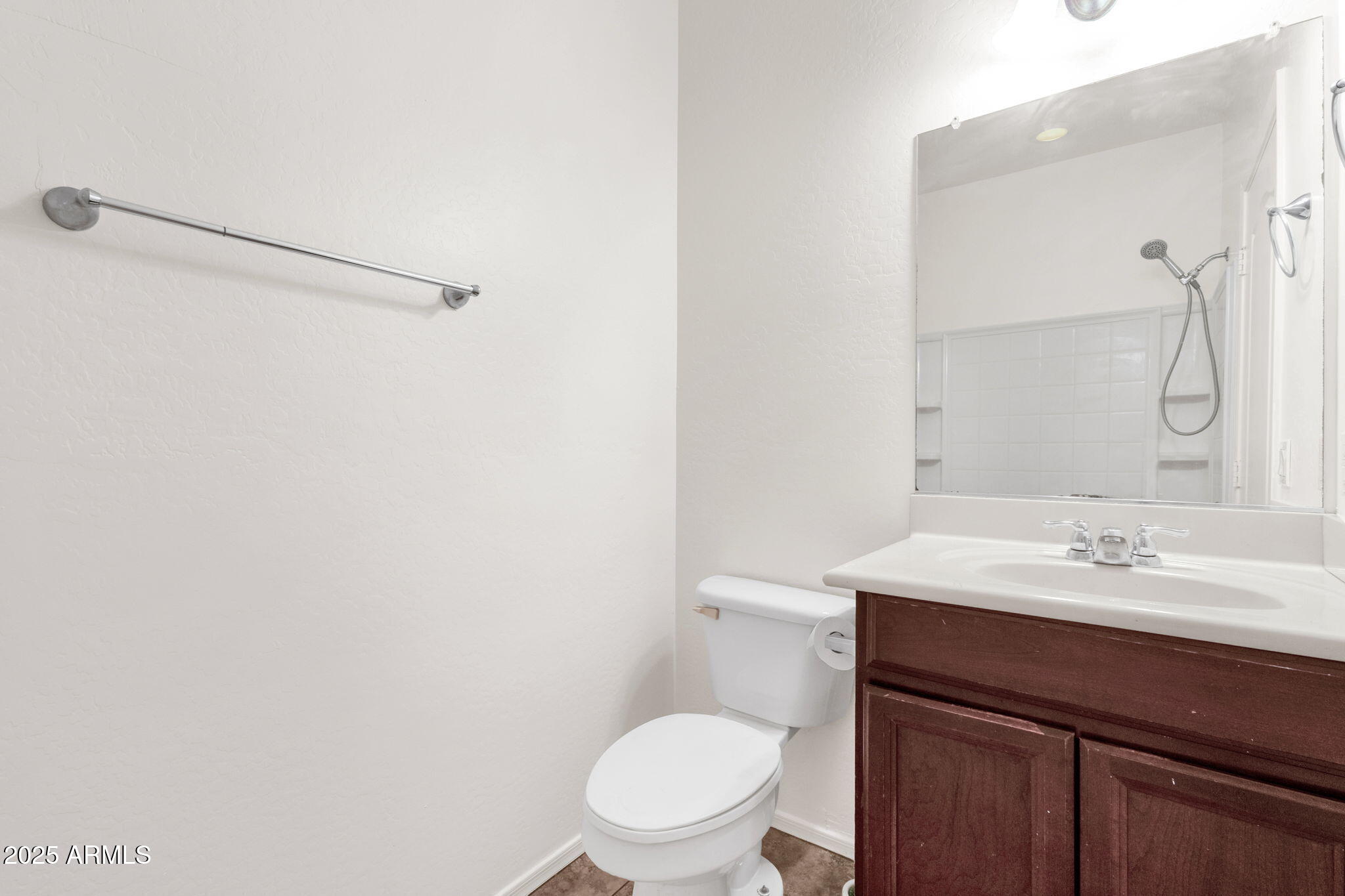 13414 North 87th Lane Peoria, AZ 85381 - Photo 17 of 45 a bathroom with a sink a toilet and shower