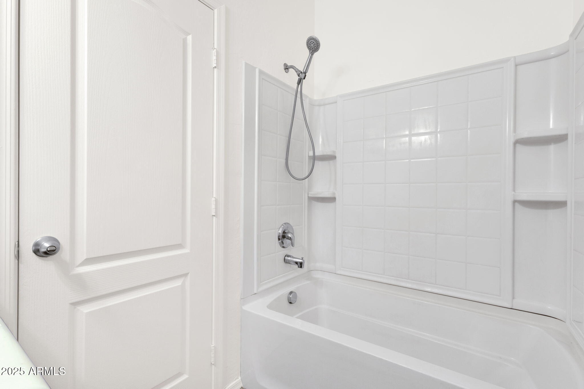 13414 North 87th Lane Peoria, AZ 85381 - Photo 18 of 45 a bathroom with a bathtub and shower