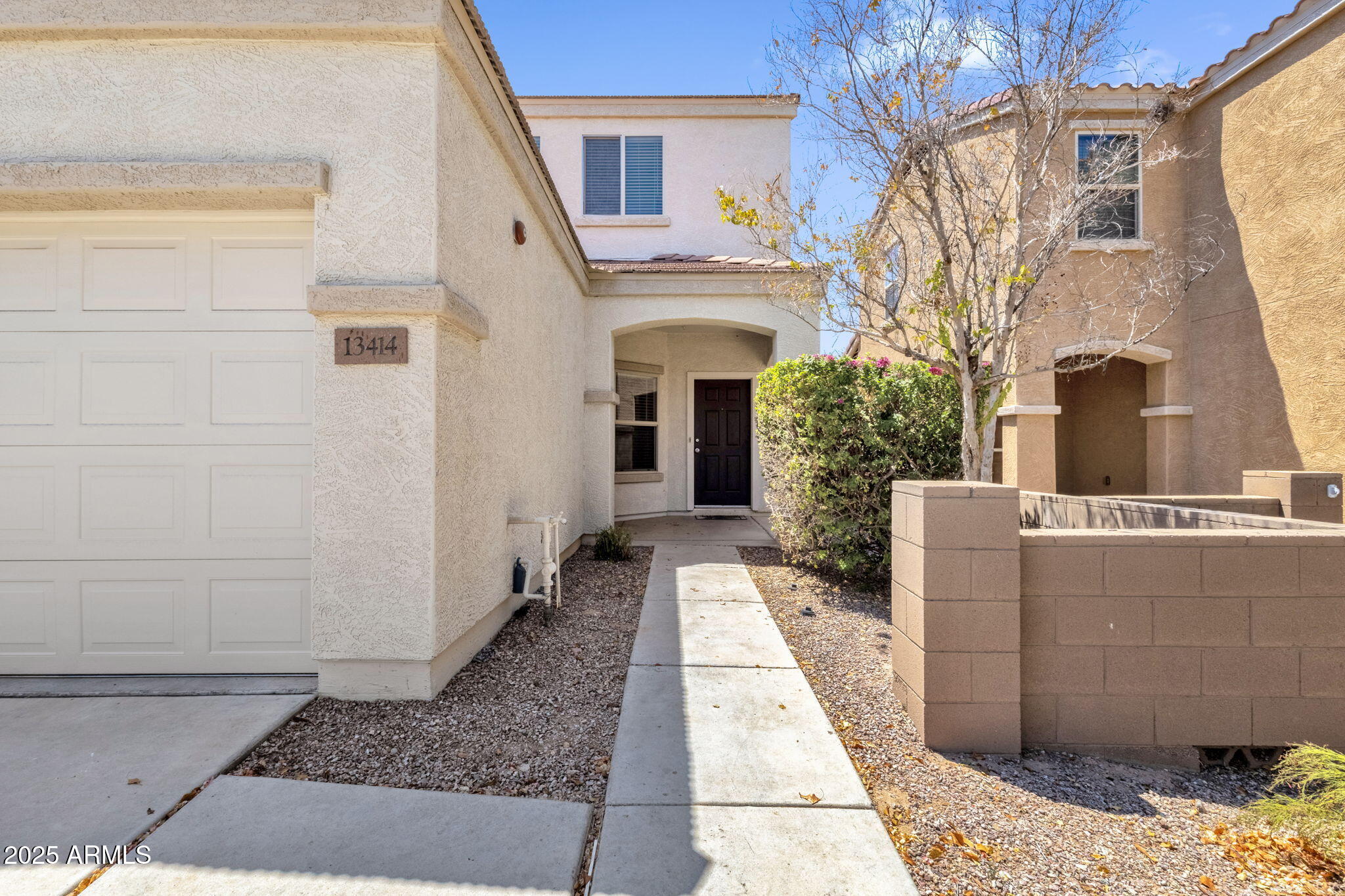 13414 North 87th Lane Peoria, AZ 85381 - Photo 3 of 45 a view of a house with a entrance