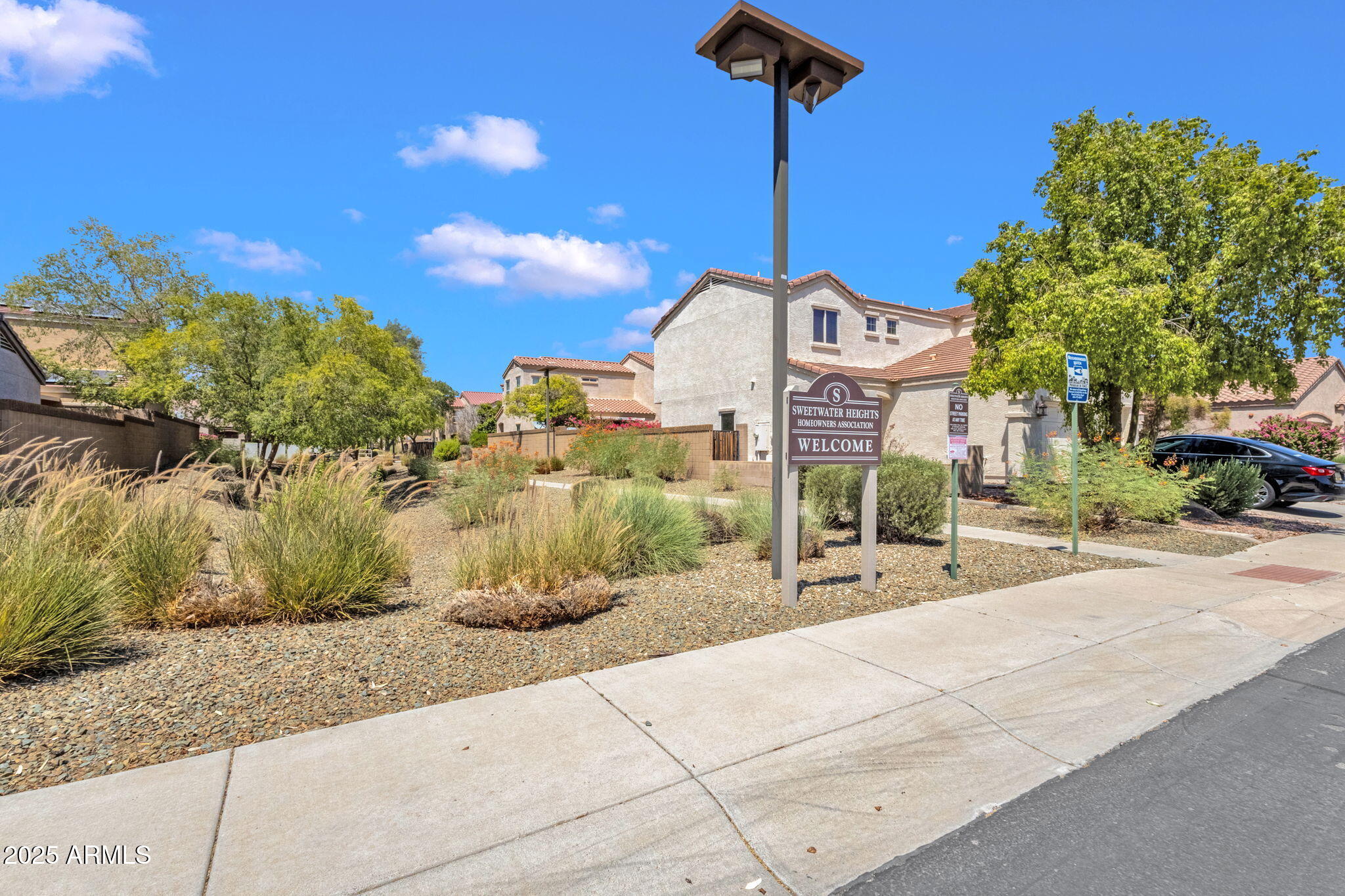 13414 North 87th Lane Peoria, AZ 85381 - Photo 38 of 45 a sign board with tall buildings