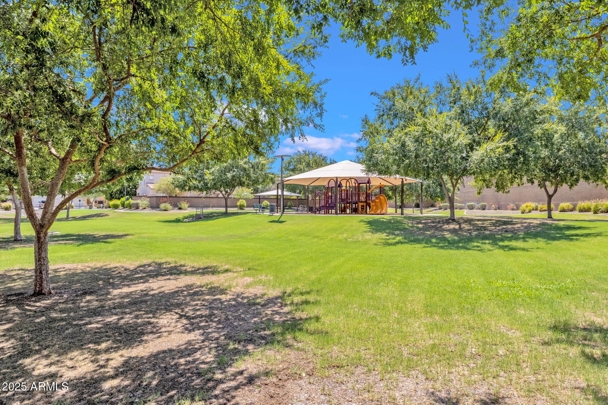 13414 North 87th Lane Peoria, AZ 85381 - Photo 39 of 45 a view of yard with swimming pool and green space