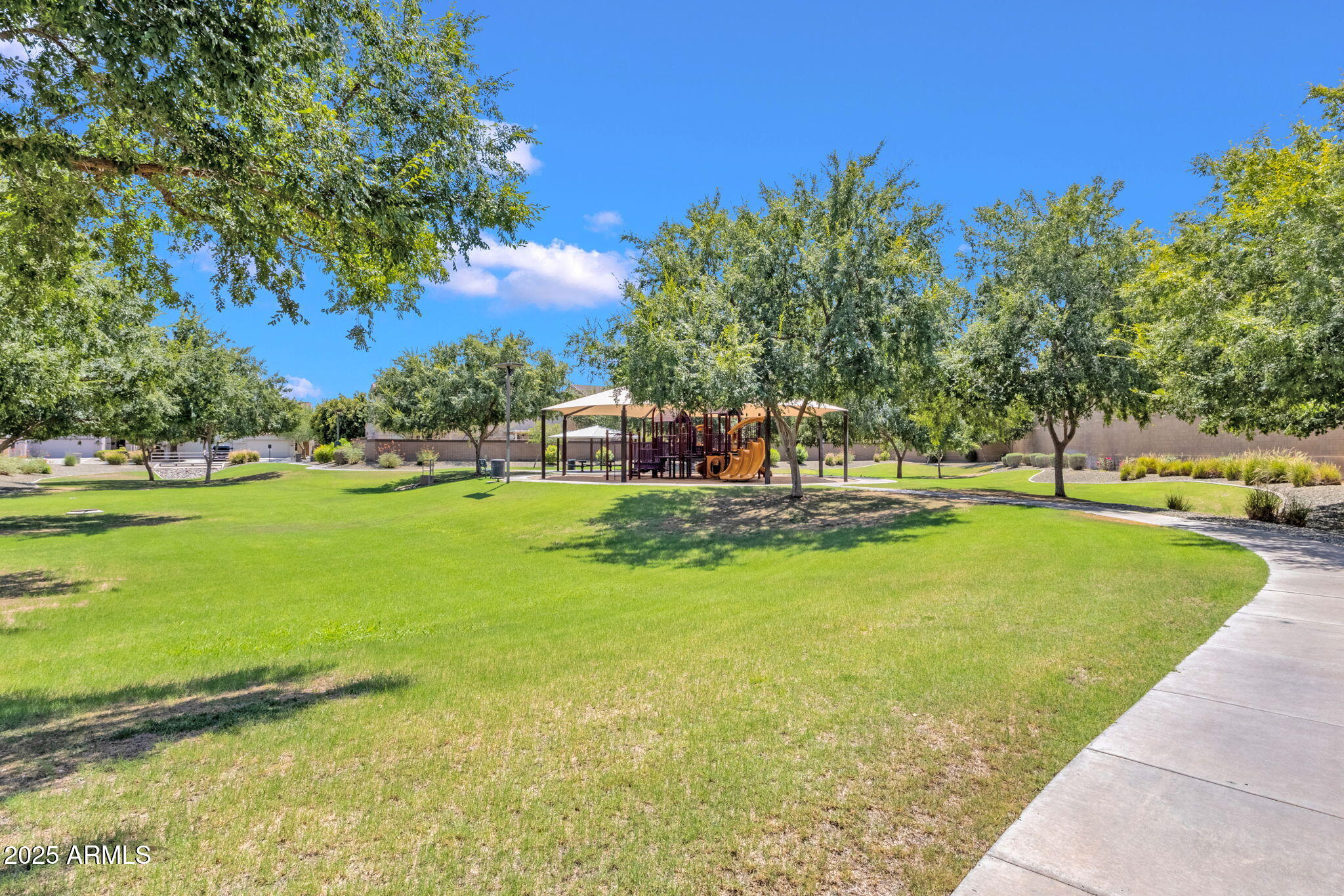 13414 North 87th Lane Peoria, AZ 85381 - Photo 40 of 45 a view of yard with swimming pool and green space