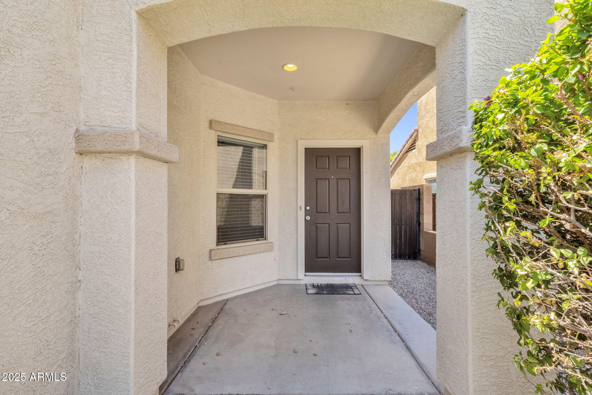 13414 North 87th Lane Peoria, AZ 85381 - Photo 4 of 45 a view of a hallway with wooden shelves