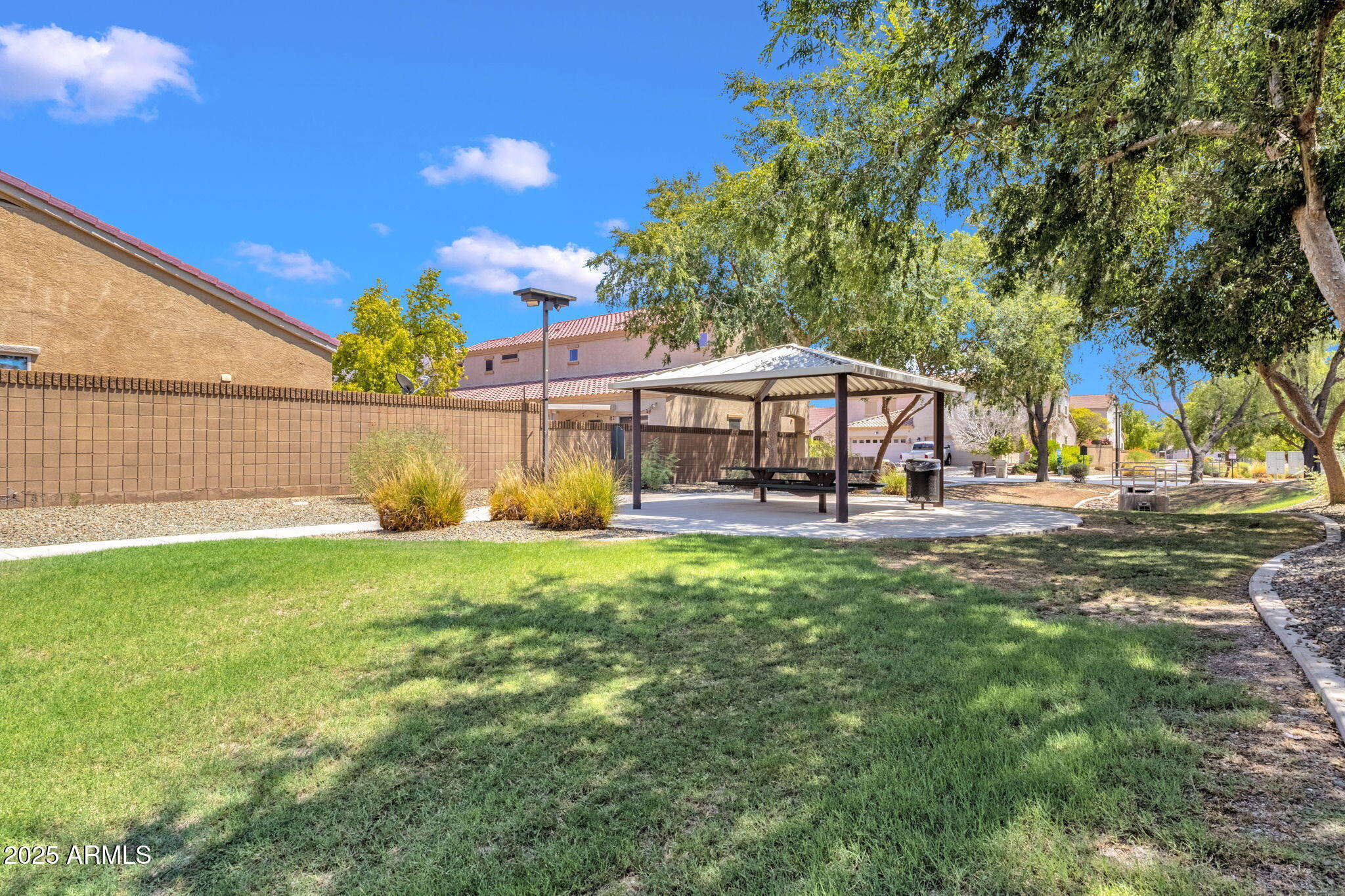 13414 North 87th Lane Peoria, AZ 85381 - Photo 44 of 45 a front view of a house with garden