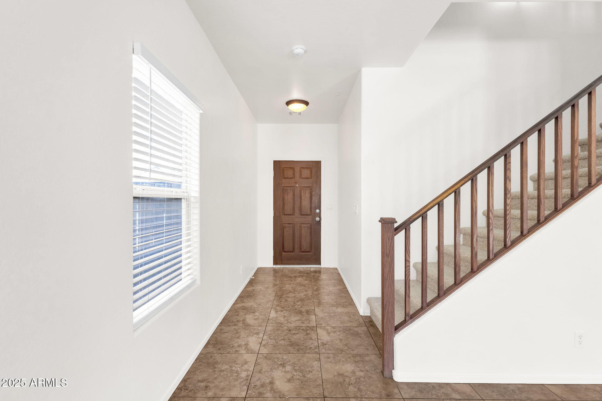 13414 North 87th Lane Peoria, AZ 85381 - Photo 5 of 45 a view of a hallway with entryway