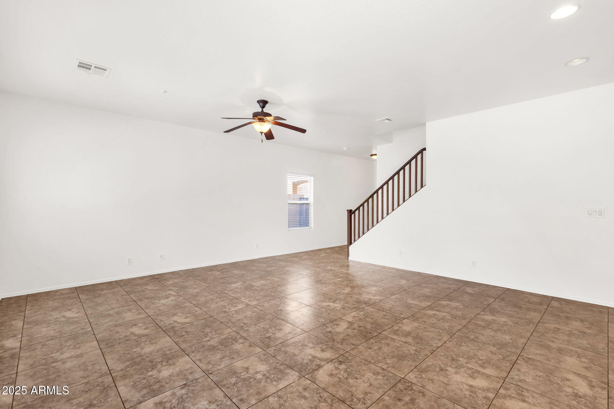 13414 North 87th Lane Peoria, AZ 85381 - Photo 8 of 45 a view of an empty room