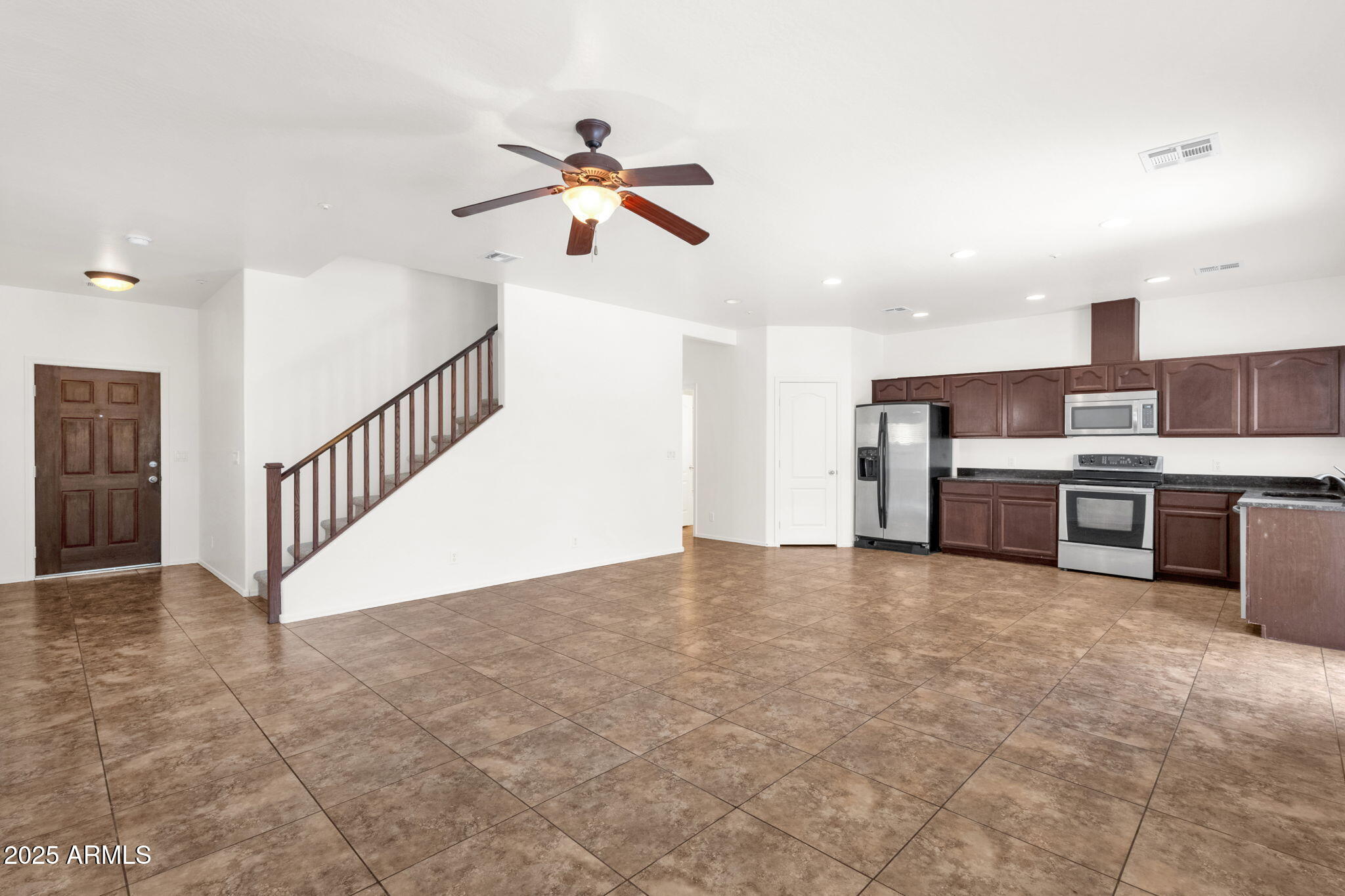 13414 North 87th Lane Peoria, AZ 85381 - Photo 9 of 45 a view of a kitchen with a sink and a window