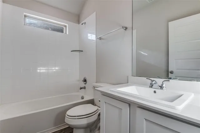 a bathroom with a sink toilet and a bathtub