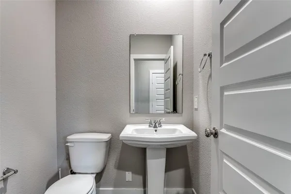 a bathroom with a sink and a toilet