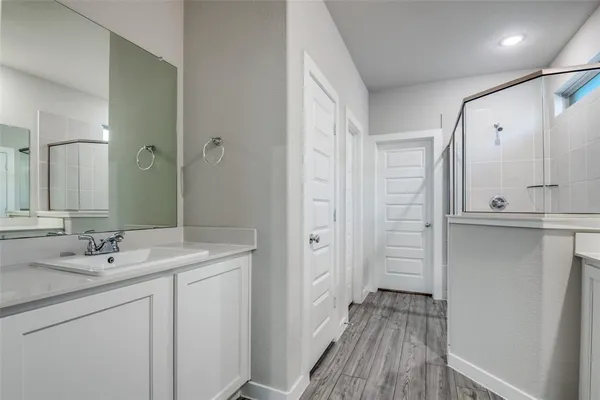a bathroom with a sink and a mirror