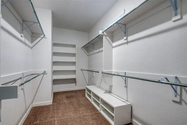 a view of an empty walk in closet