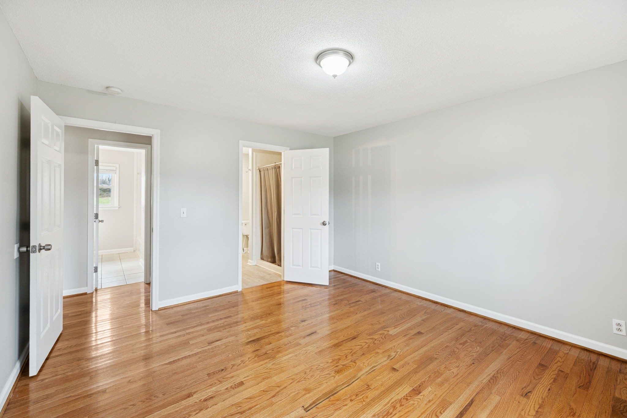 2053 West Jefferson Pike Murfreesboro, TN 37129 - Photo 20 of 86 a view of an empty room with wooden floor