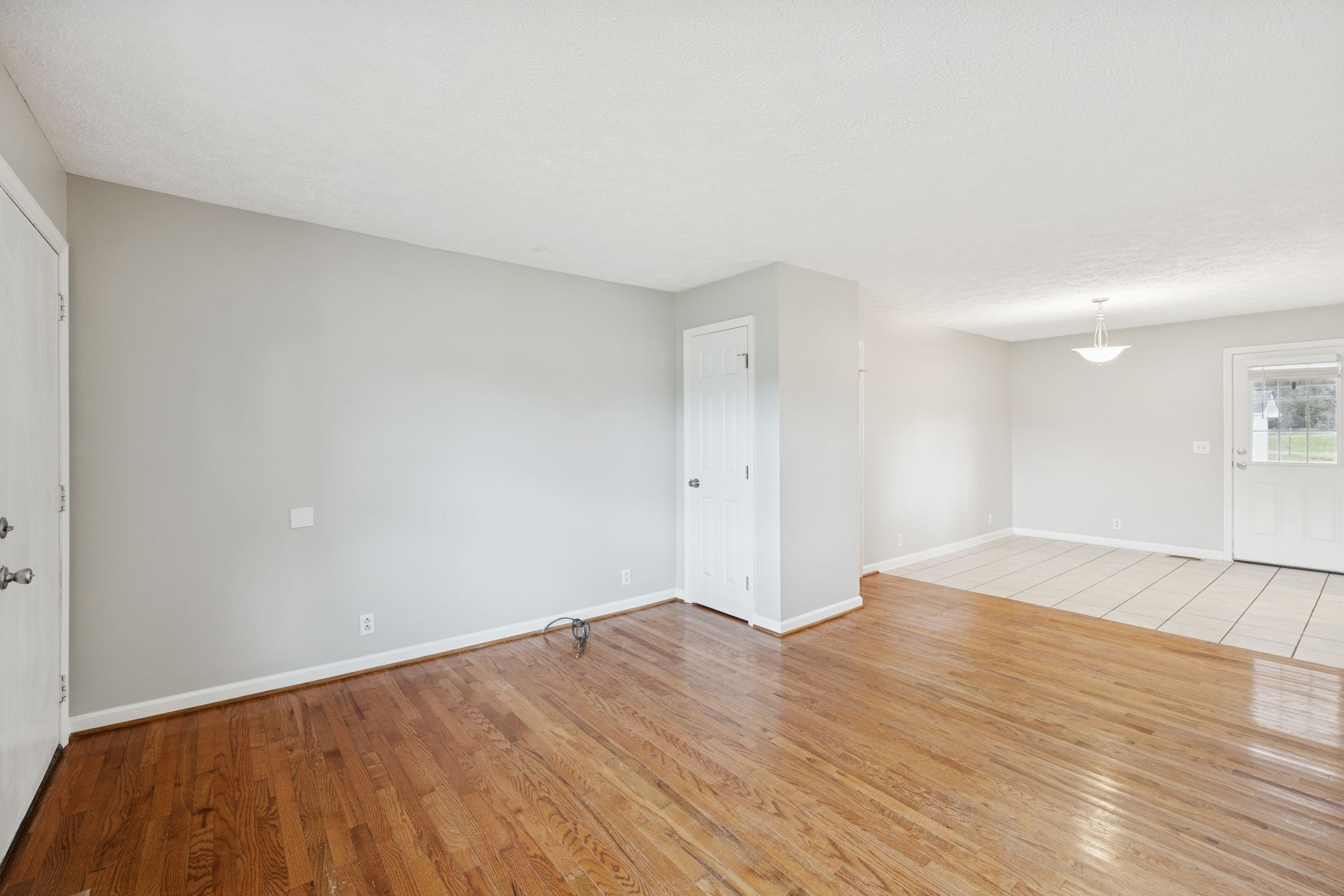 2053 West Jefferson Pike Murfreesboro, TN 37129 - Photo 71 of 86 a view of an empty room with wooden floor and a window