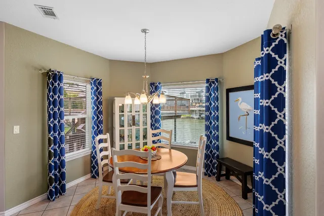 a bathroom with a granite countertop sink a large mirror and a bathtub