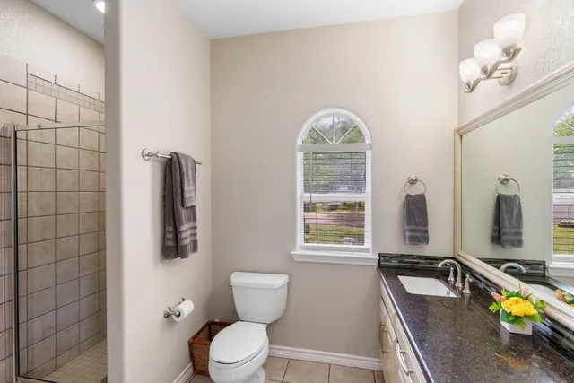 a view of a house with pool and ocean view