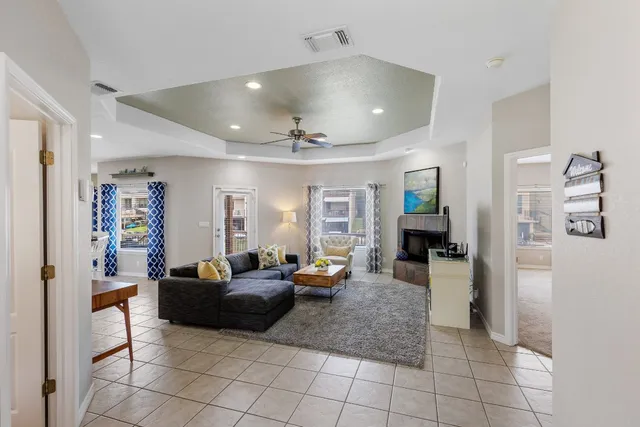 a living room with furniture and a fireplace