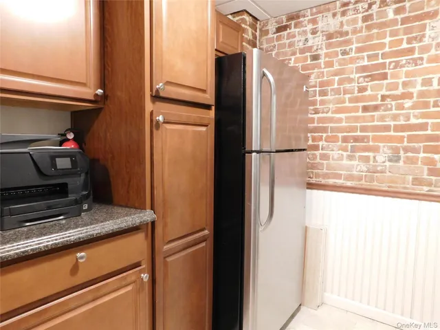 a view of a refrigerator and car parked