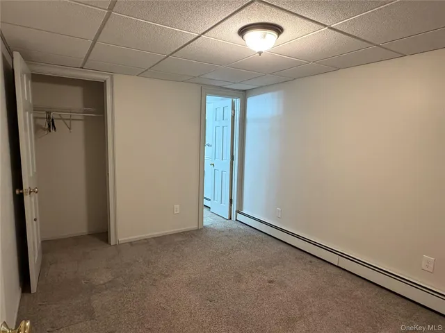 an empty room with closet area