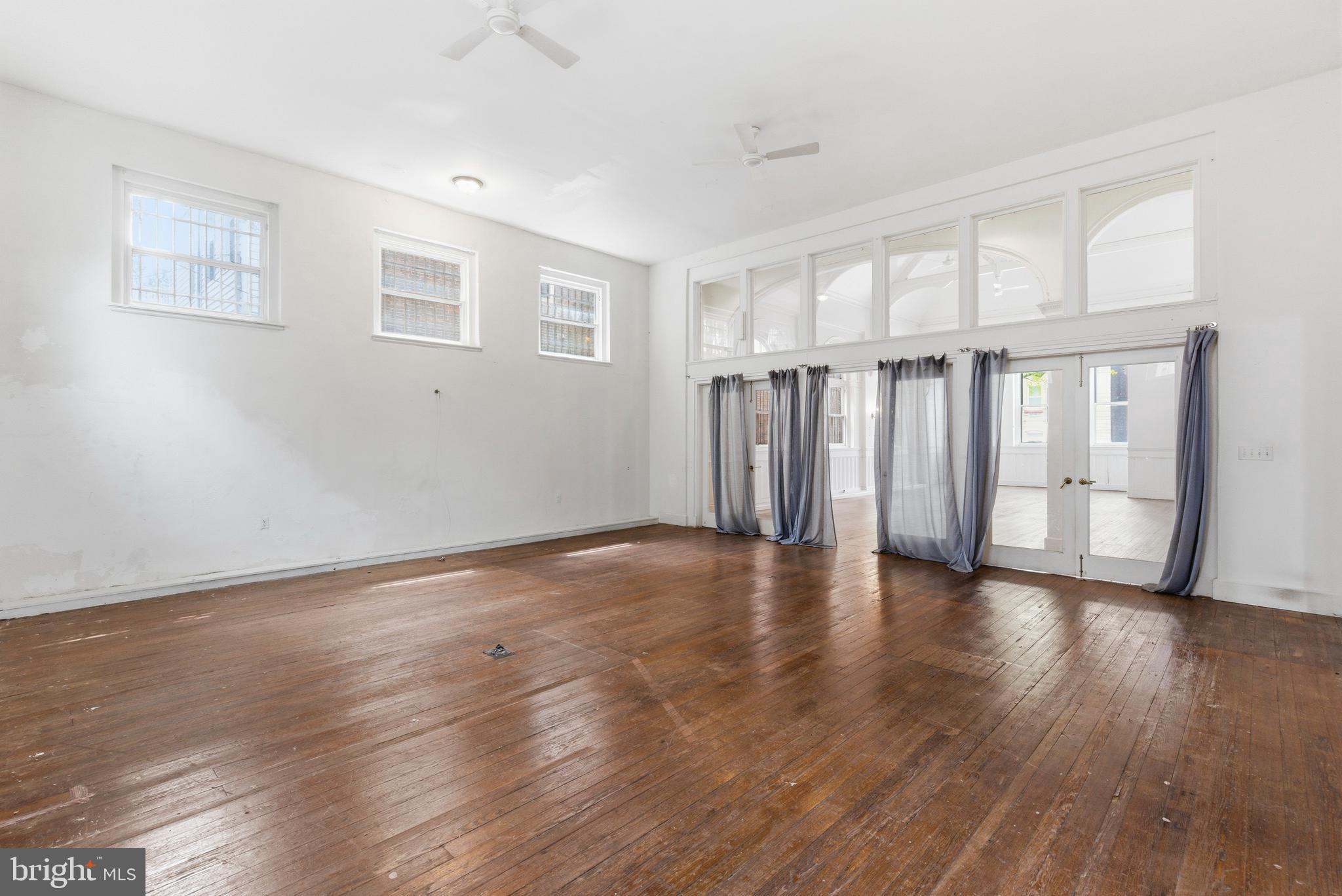 1401 Light Street Baltimore, MD 21230 - Photo 19 of 39 a view of an empty room with wooden floor and a window