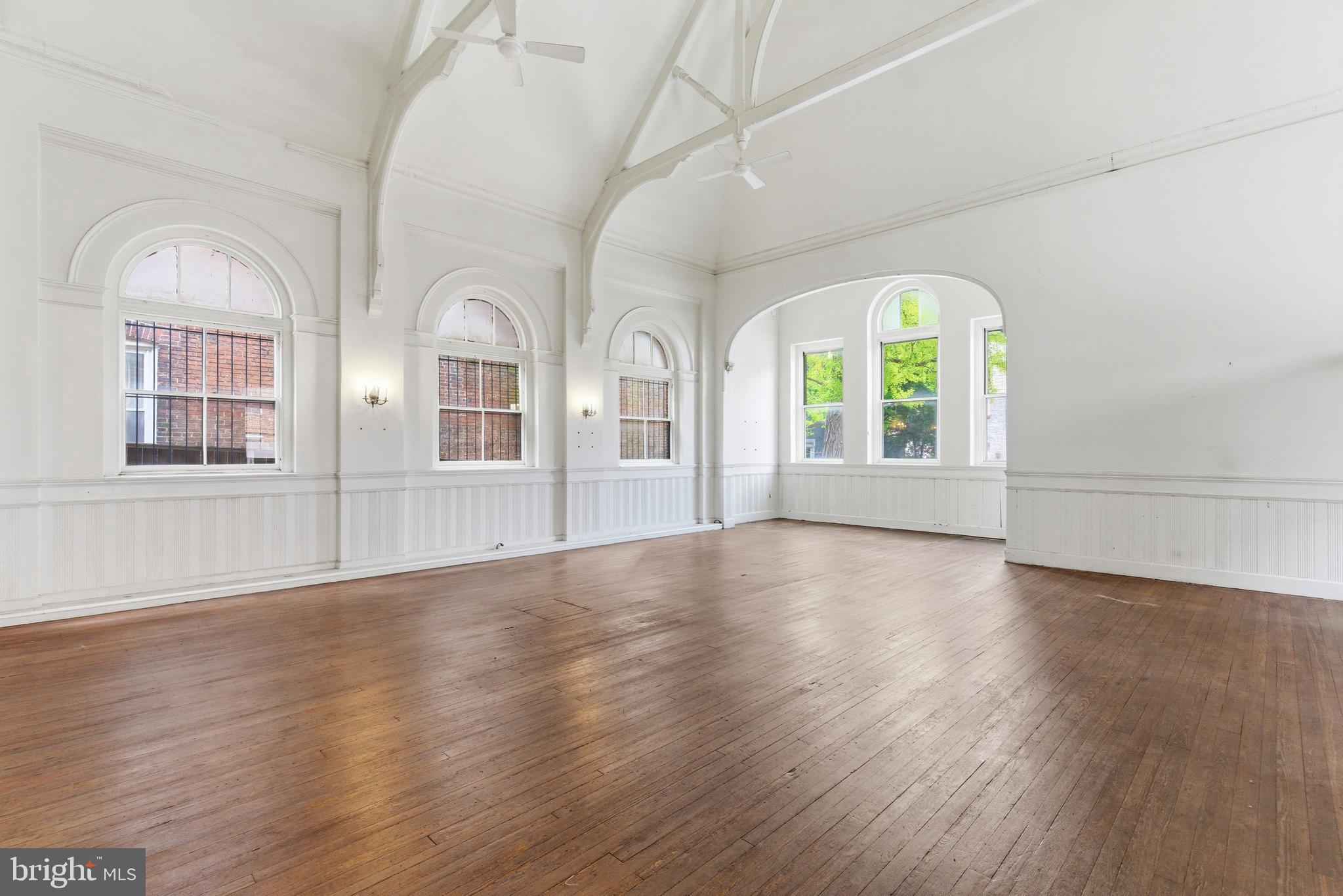 1401 Light Street Baltimore, MD 21230 - Photo 6 of 39 a view of an empty room with wooden floor and a window