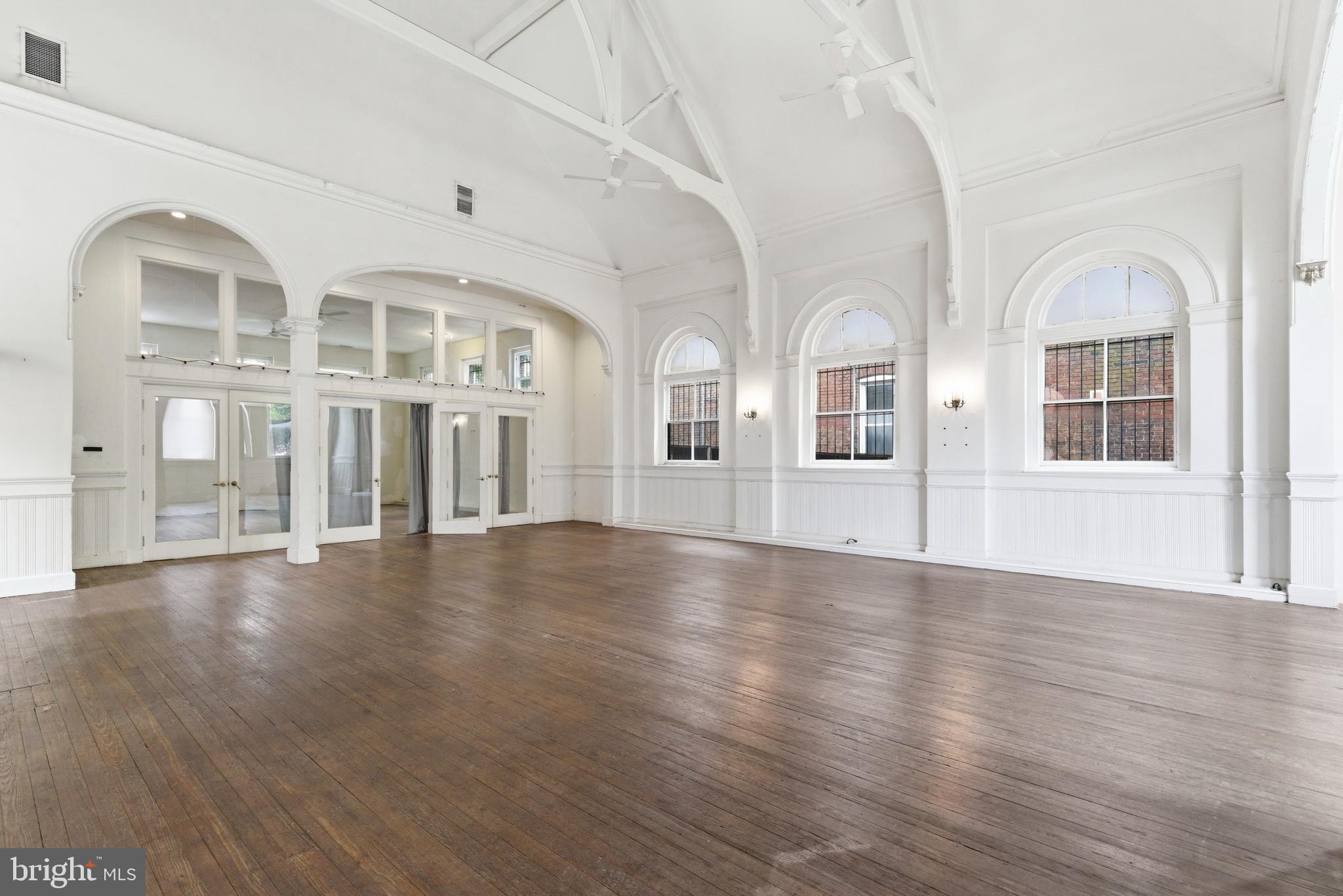 1401 Light Street Baltimore, MD 21230 - Photo 7 of 39 a view of an empty room with wooden floor and windows