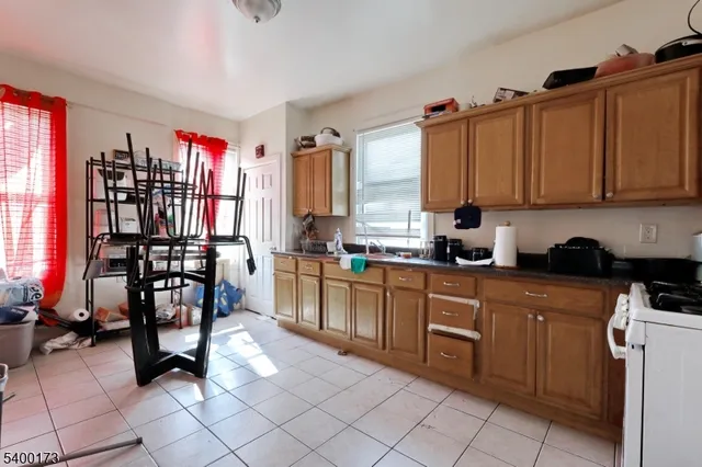 a kitchen with a sink cabinets and window