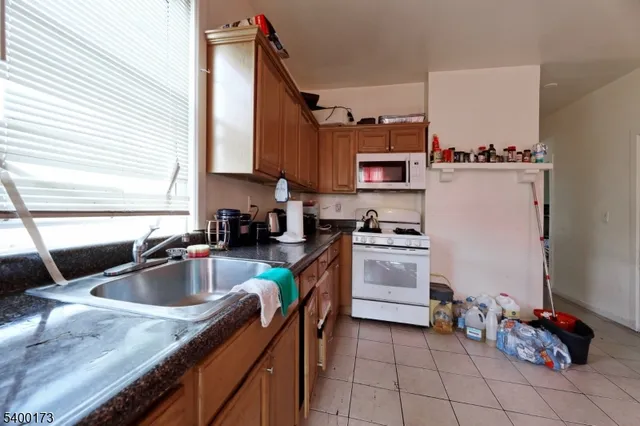 a kitchen that has a sink and cabinets in it