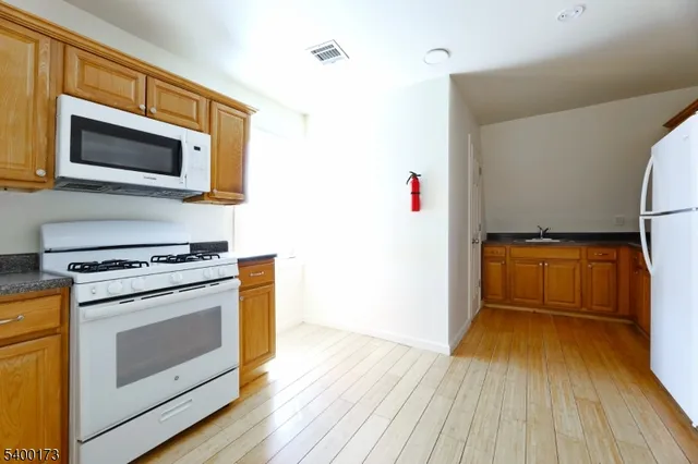 a kitchen with a stove and a microwave